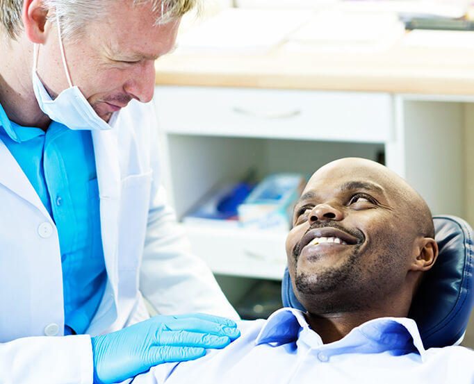 dentist comforting a patient