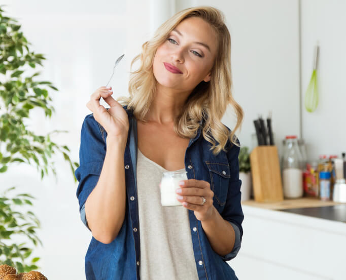 woman eating yogurt