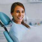 woman learning more about cavitation surgery at mckinney holistic dentist office