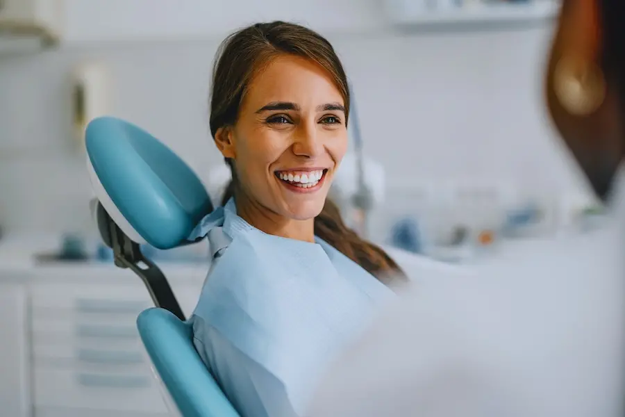 woman learning more about cavitation surgery at mckinney holistic dentist office