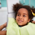 child at dental office that can provide holistic dentistry for children