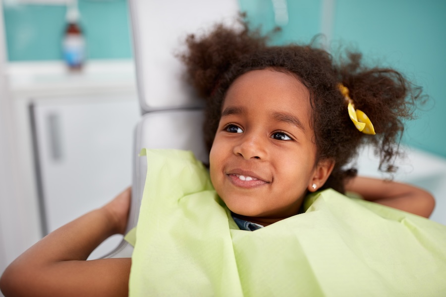 child at dental office that can provide holistic dentistry for children