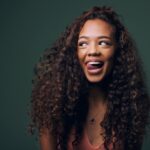woman smiling with tongue sticking out, tongue posture and jaw tension